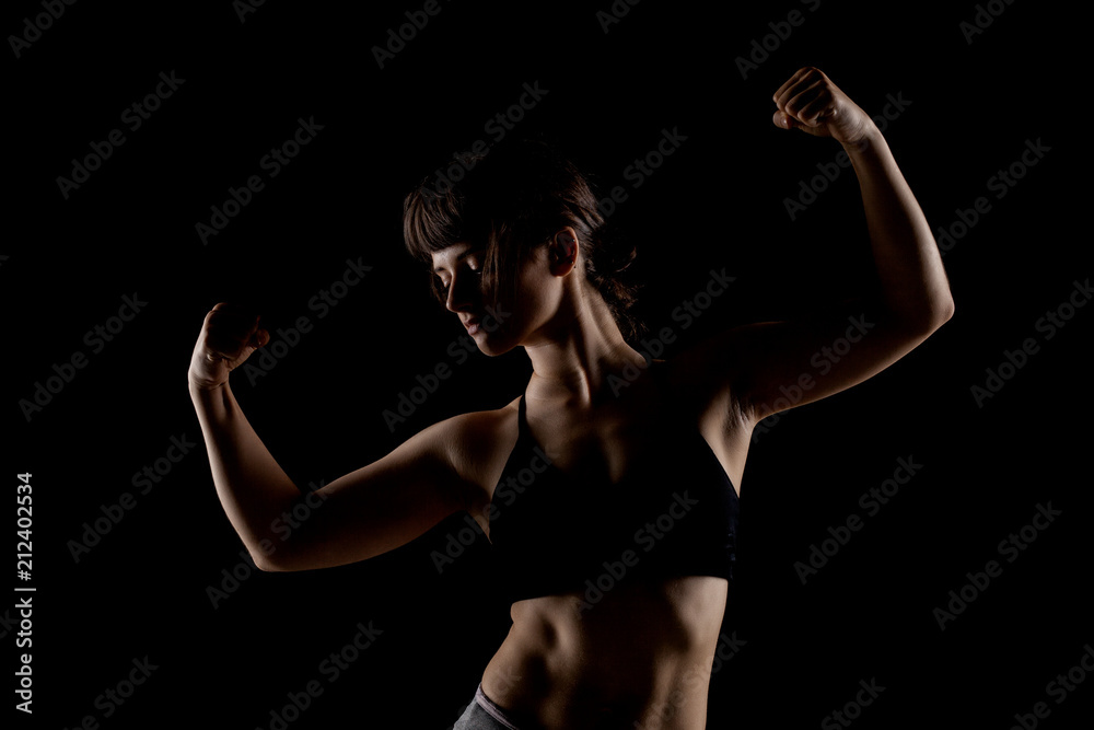 girl showing muscles