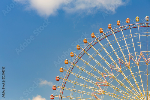 Tokyo giant ferris wheel against blue sky background