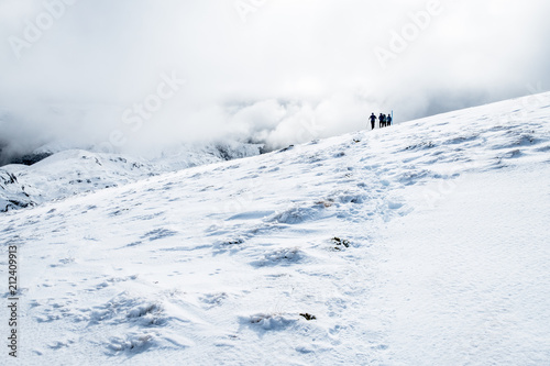 People hiking on the beautiful snow mountains. kahurangi national park, New Zealand.