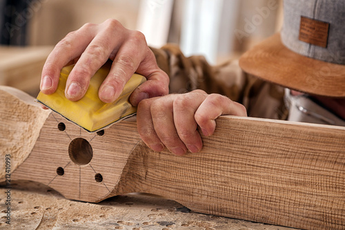 Bilde på lerret Experienced carpenter in work clothes and small buiness owner working in woodwor