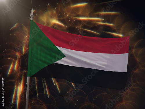 Flag of Sudan with fireworks display in the background