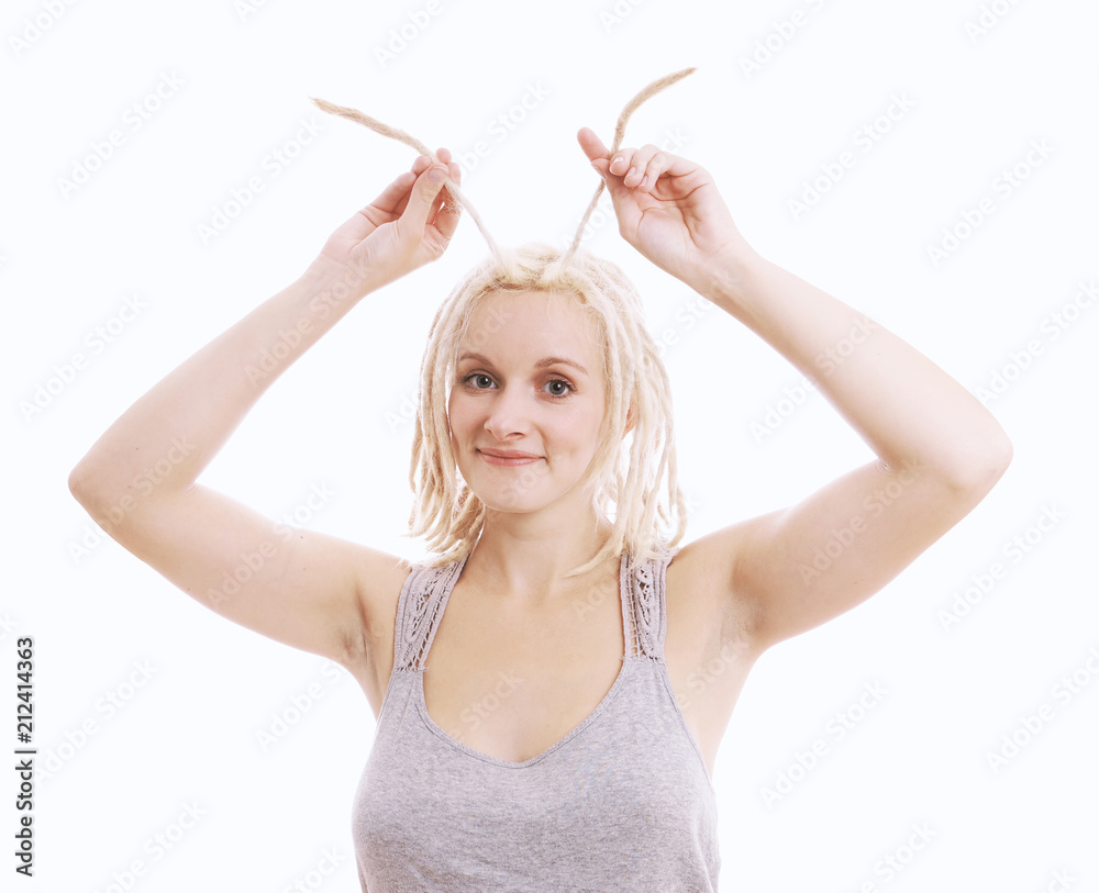 zany young woman kidding around with her blond dreadlocks, isolated on white zany young woman kidding around with her blond dreadlocks, isolated on white