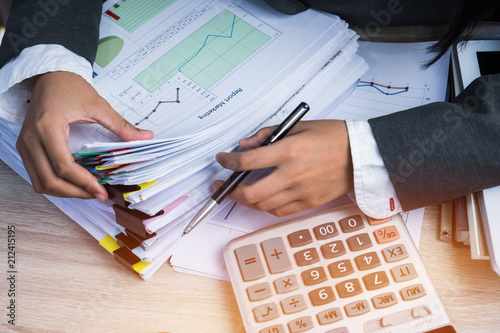 Quadro em tela Accountant Business woman Manager checking and signing applicant filling documents reports papers company application form near calculator on desk office