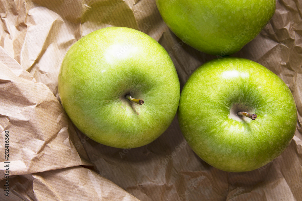 green apples on brown packing paper green apples on brown packing paper