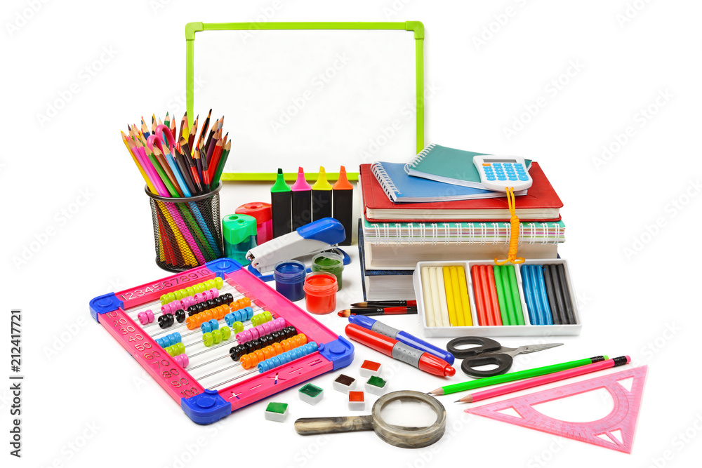 Assortment of school and office supplies isolated on white background.