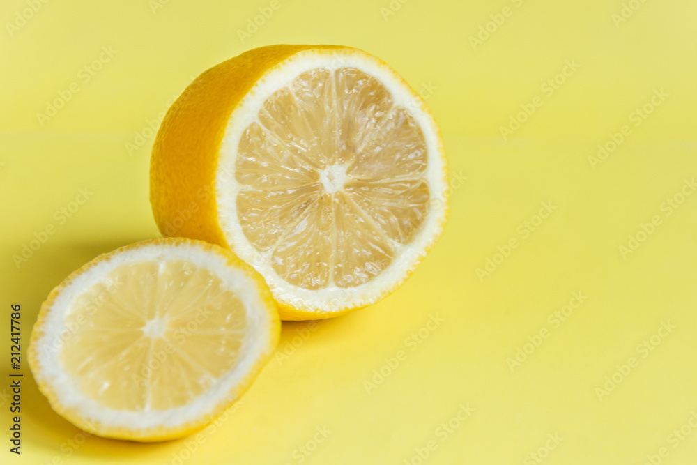 Lemon on yellow background. Sour tropical citrus fruit. Lemon on yellow background. Sour tropical citrus fruit.