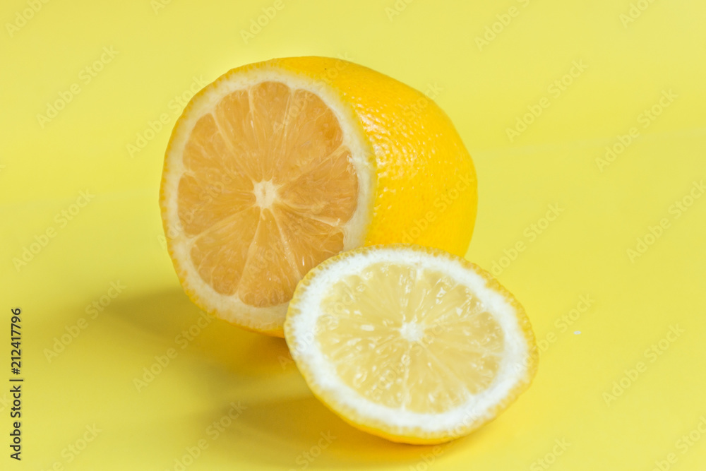 Lemon on yellow background. Sour tropical citrus fruit. Lemon on yellow background. Sour tropical citrus fruit.