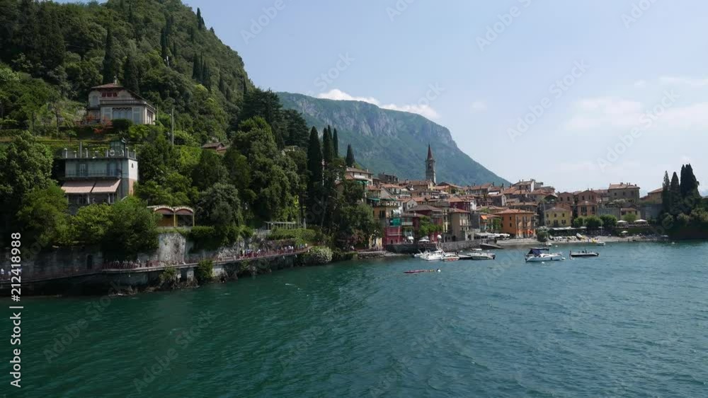 View of Varenna town one of the small beautiful towns on Como lake seen from ferry, Lombardy, Italy View of Varenna town one of the small beautiful towns on Como lake seen from ferry, Lombardy, Italy