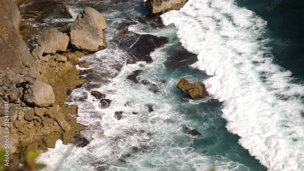 Beautiful landscape of stone cliffs, ocean waves and oceanscape. Aerial top view. Bali, Indonesia. slow motion. 3840x2160 Beautiful landscape of stone cliffs, ocean waves and oceanscape. Aerial top view. Bali, Indonesia. slow motion. 3840x2160