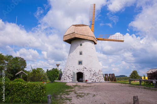 Old windmills and nature, green grass and blue sky. photo