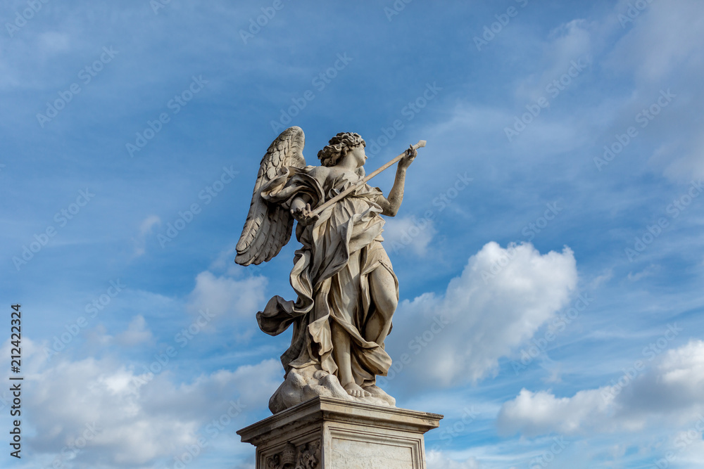 Statue with blue sky and fluffy cloud background