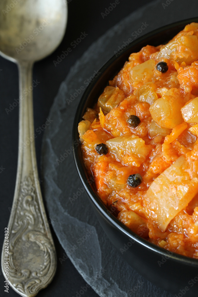 Vegetarian ragout of summer vegetables (zucchini, carrots, tomatoes, spices, garlic)