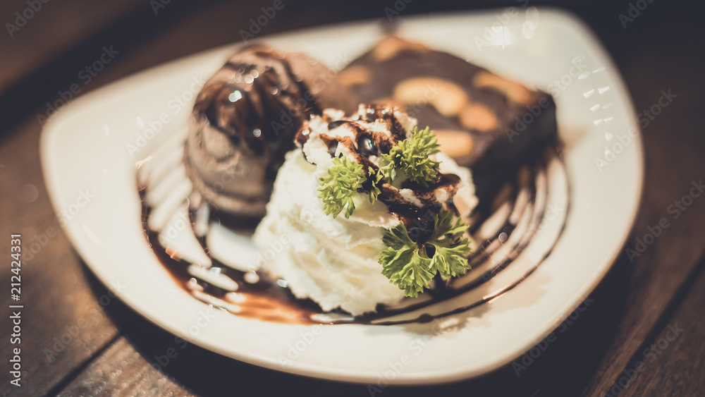Chocolate lava on white cake ice scream decorative on plate Chocolate lava on white cake ice scream decorative on plate