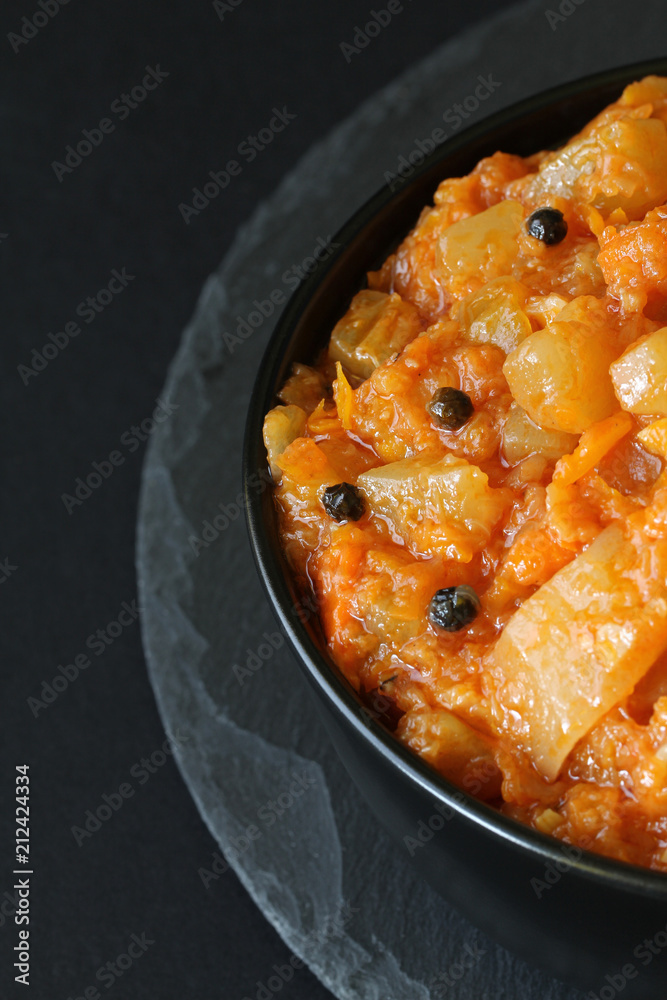 Vegetarian ragout of summer vegetables (zucchini, carrots, tomatoes, spices, garlic)