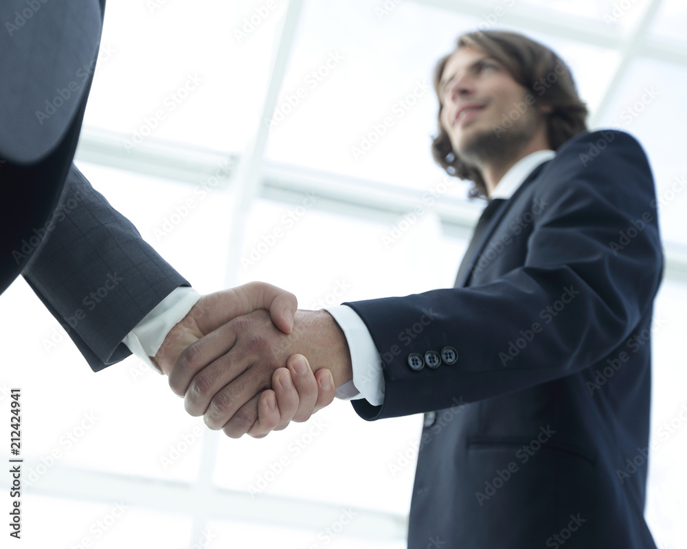 Businessmen making handshake - business etiquette, congratulatio