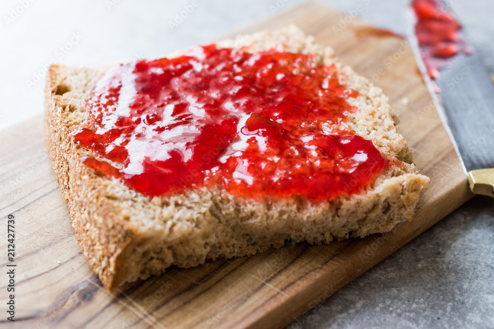 Red Plum Marmalade Jam with Bread and in glass Bowl. Red Plum Marmalade Jam with Bread and in glass Bowl.