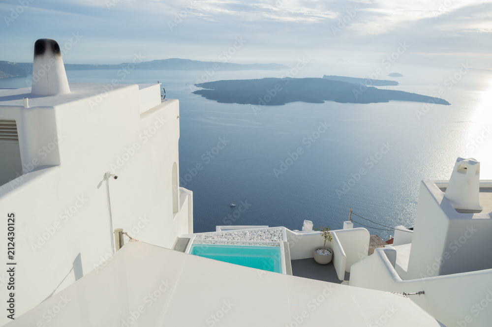 Fototapeta Whitewashed Houses on Cliffs with Sea View and Pool in Imerovigli, Santorini, Cyclades, Greece