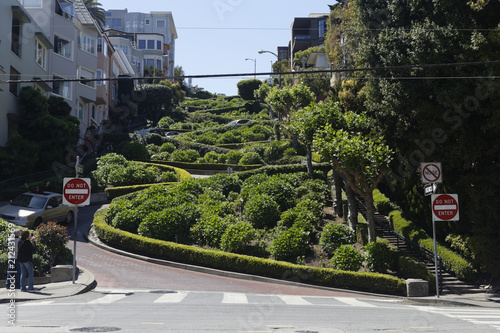 Lombard Street view from Leavenworth St. in San Francisco, famous for a steep section with eight sharp turns make it the most crooked street in the world and an important tourist attraction.