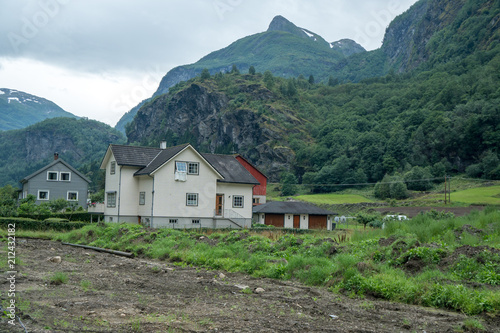 wood house in the countryside of norway with blanked out of the window