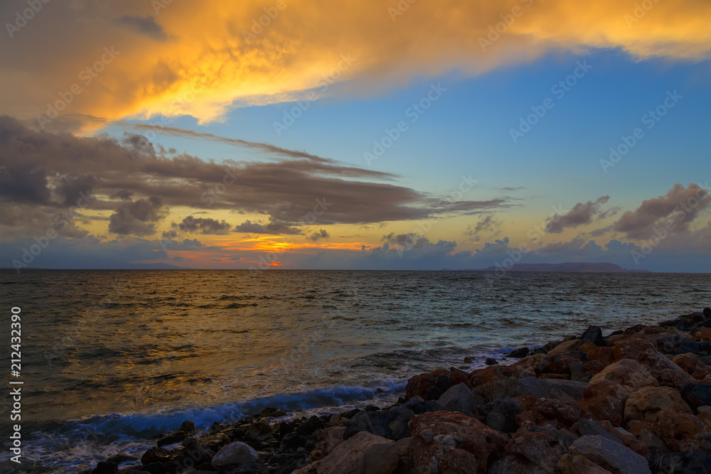Obraz premium Slow shutter seascape view black stone in beautiful sunrise