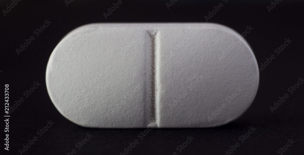 Tablet on a black background, close-up, macro Tablet on a black background, close-up, macro