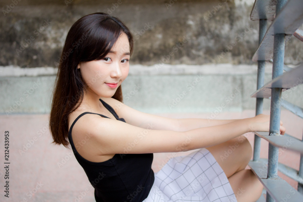 Fototapeta premium Portrait of thai china adult beautiful girl relax and smile