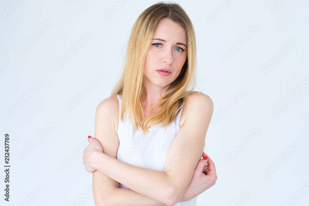 emotion face. sad worried upset concerned unhappy woman. young beautiful blond girl portrait on white background. emotion face. sad worried upset concerned unhappy woman. young beautiful blond girl portrait on white background.