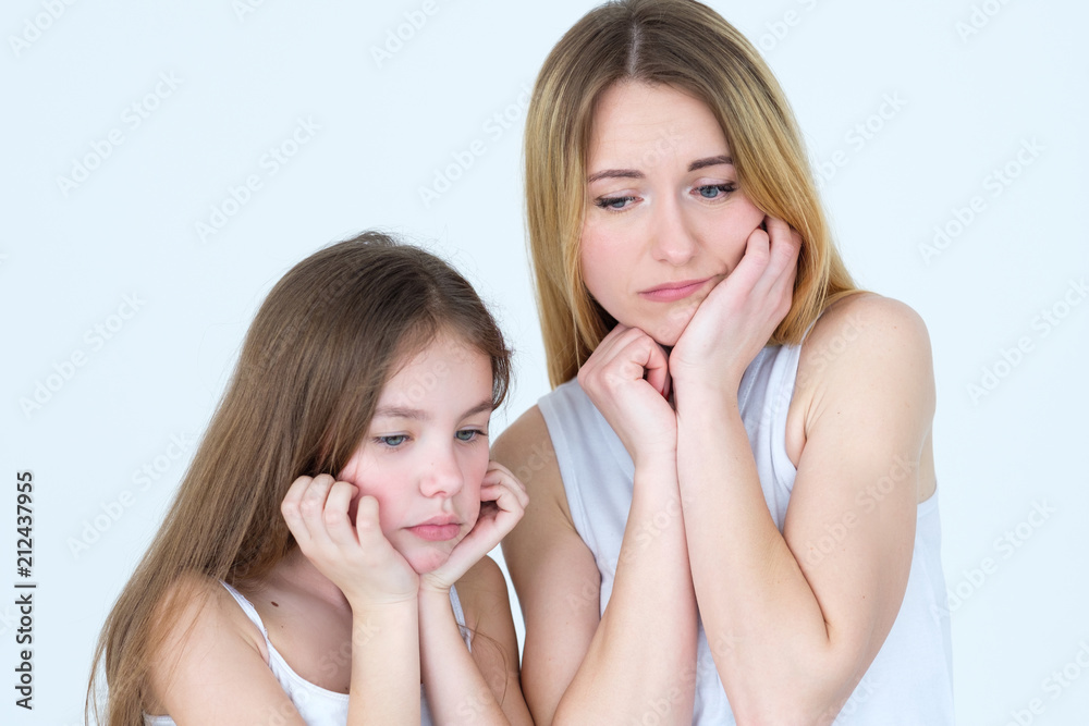 sad pensive lonely pair of mother and daughter. waiting missing someone. family life downfalls and unpleasant situations sad pensive lonely pair of mother and daughter. waiting missing someone. family life downfalls and unpleasant situations