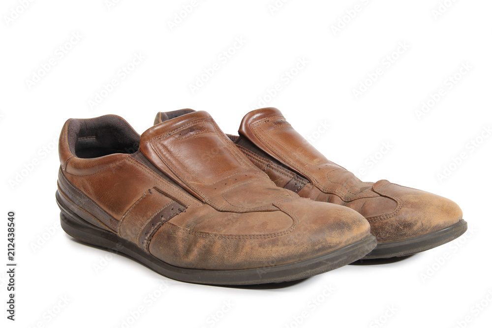 Old leather shoes on a white background Old leather shoes on a white background