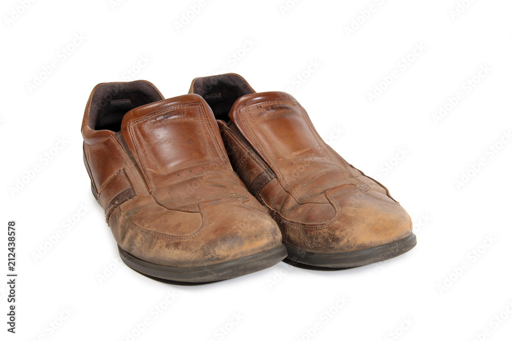 Old leather shoes on a white background