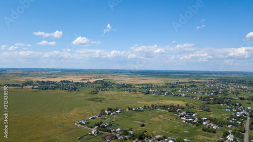 aerial view of a house in a scenic countryside hills on a sunny day photo