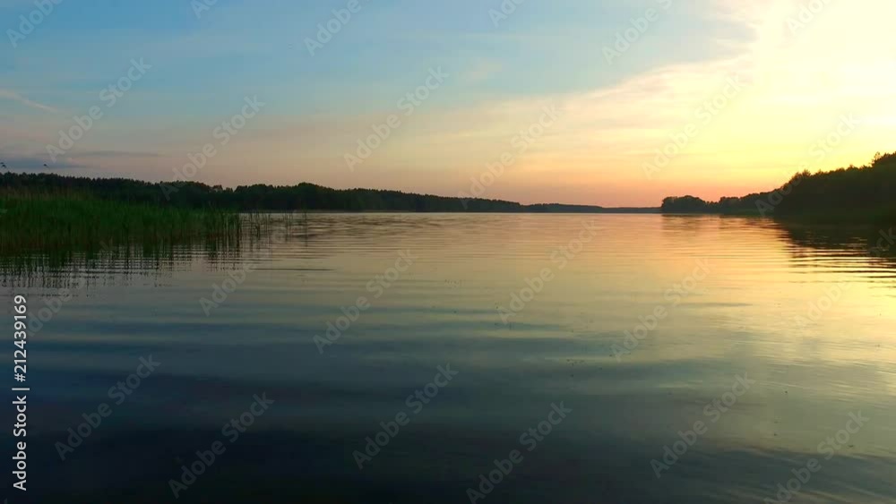 Calm lake at sunset in the summer Calm lake at sunset in the summer