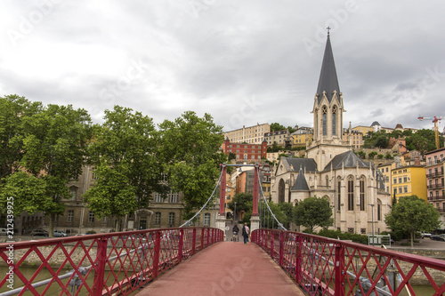 Church of Saint Georges and footbridge, Lyon, France. Panoramic view of Saint Georges church and pedestrian footbridge across Saone river, Old town with Fourviere cathedral..