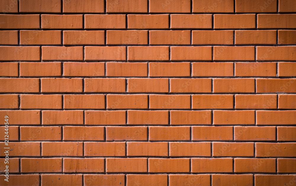 textured decorative orange brick wall. background, vignette, architecture. textured decorative orange brick wall. background, vignette, architecture.