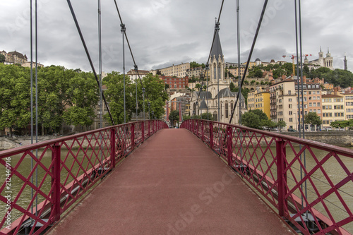 Church of Saint Georges and footbridge, Lyon, France. Panoramic view of Saint Georges church and pedestrian footbridge across Saone river, Old town with Fourviere cathedral..