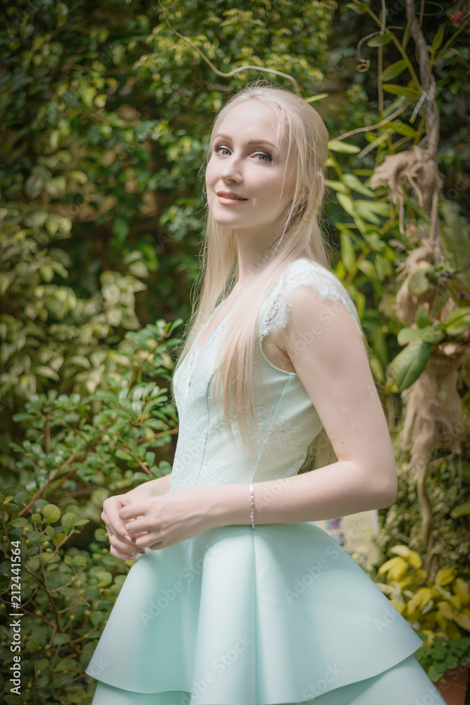 Summertime portrait of beautiful young woman. Selective focus.