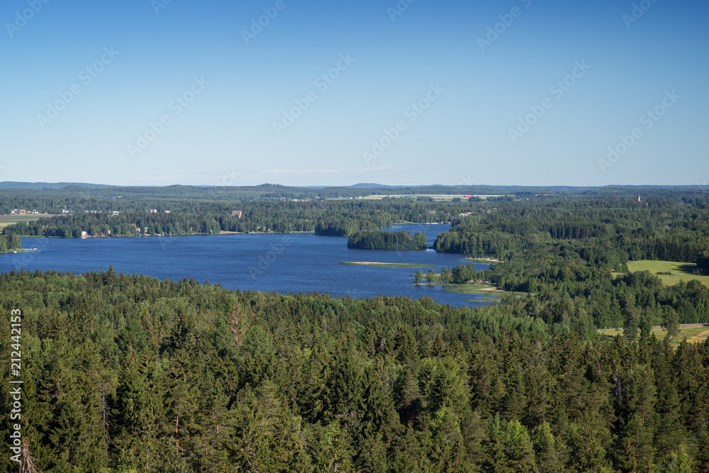 Scenic view of a lake and forests from Aulanko lookout tower in Hämeenlinna, Finland, on a sunny day in the summer. Copy space.