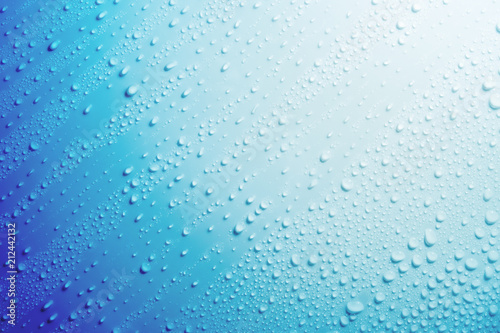 Water droplets on blue background.