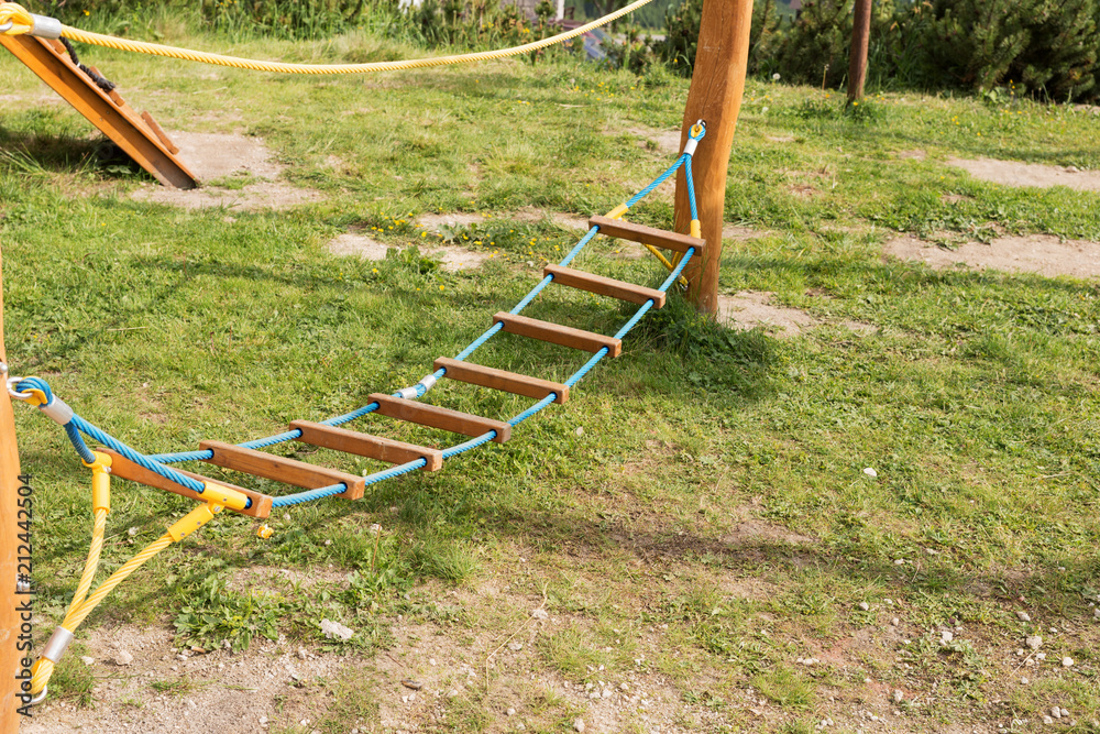 Modern wooden children playground in the park Modern wooden children playground in the park