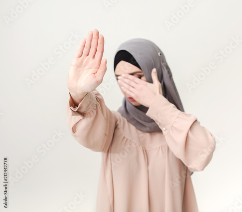 Muslim woman making stop gesture