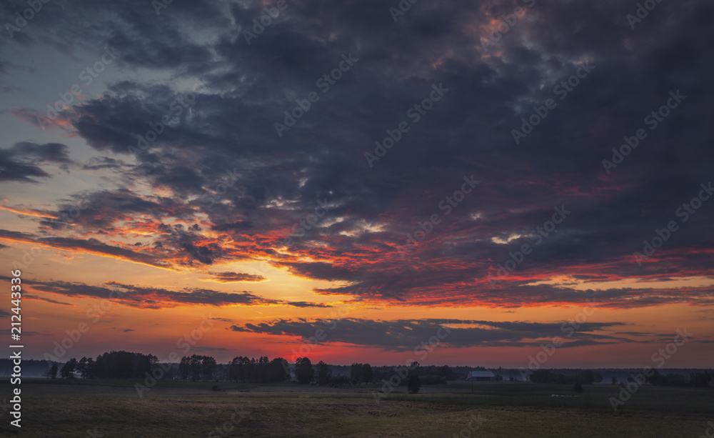 Obraz premium Colorful Twilight Sky over Scenic Countryside at Summer