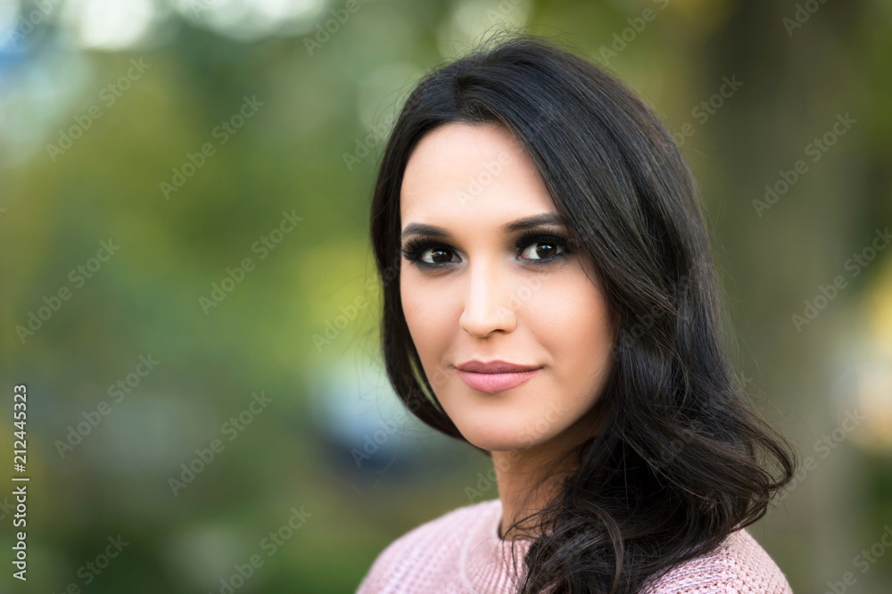 young fashion woman portrait in a park in autumn young fashion woman portrait in a park in autumn