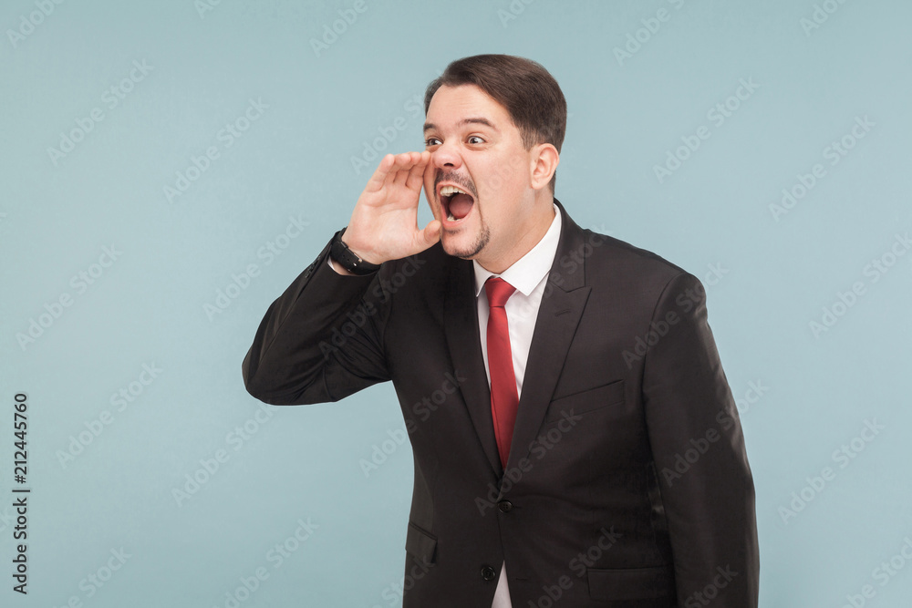 Hey some one! Worry businessman shout and fear. Indoor, studio shot, isolated on light blue background. handsome businessman with black suit, red tie and mustache looking away. Hey some one! Worry businessman shout and fear. Indoor, studio shot, isolated on light blue background. handsome businessman with black suit, red tie and mustache looking away.