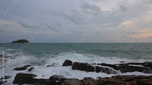 beautiful sea wave breaking on a stony tropical beach under the bright blue sky at summer day from tilt shift lens, high definition, Full HD, 1920x1080
