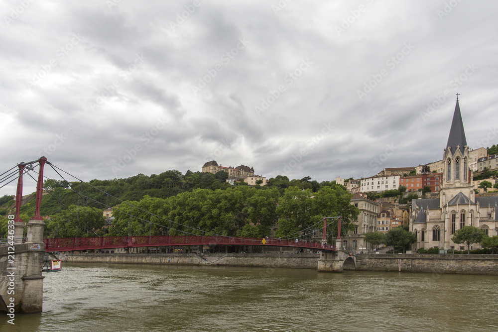 Church of Saint Georges and footbridge, Lyon, France. horizontal view of Lyon and Saone River in France.