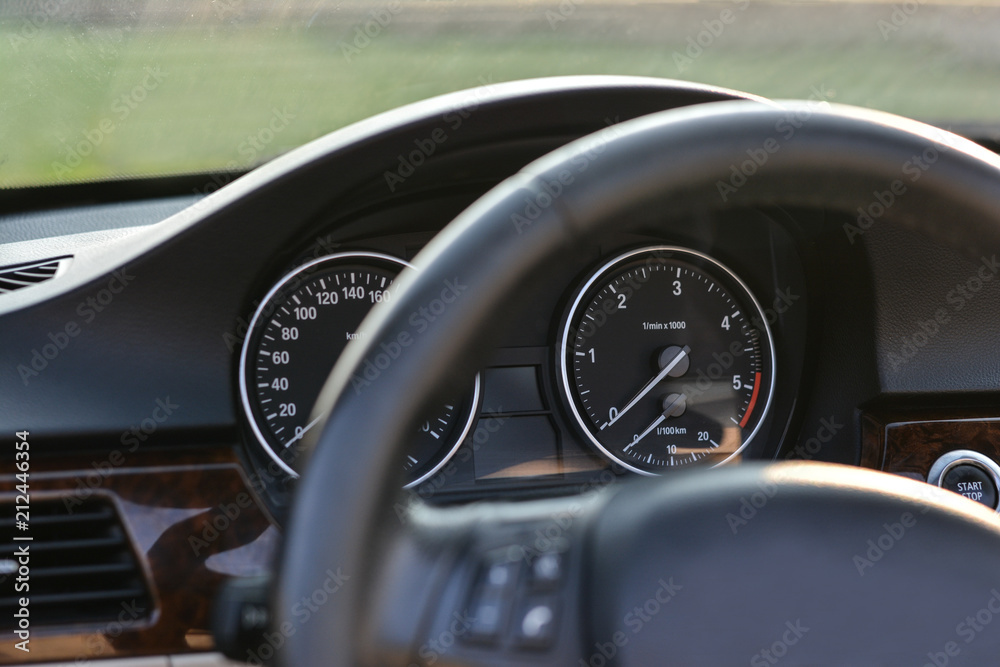 Close up shot of a speedometer in a car.