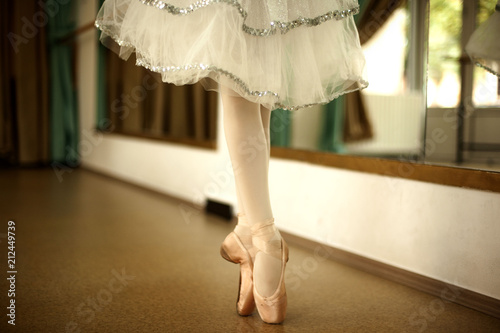 Little ballerina in ballet studio