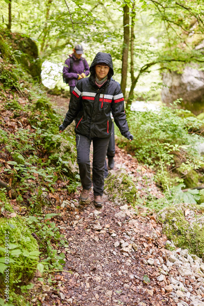 Group of people hiking on a trail Group of people hiking on a trail