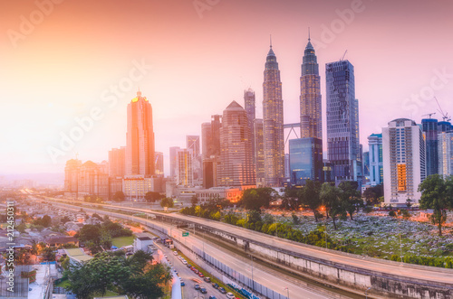 Landscape of Kuala Lumpur skyscraper with colorful sunrise sky  Malaysia..