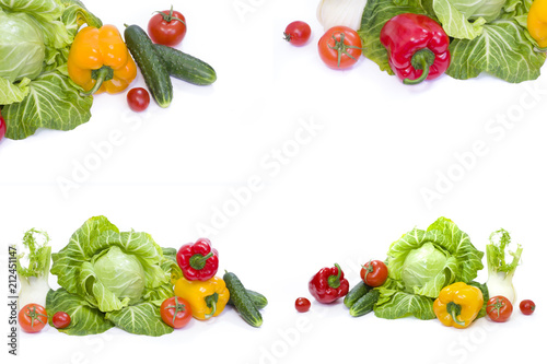 Green cabbage. Yellow pepper. Red tomatoes and cucumbers on a white background.
